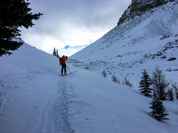 Mike skis up the final icy, wind blown section before Boulder Pass.