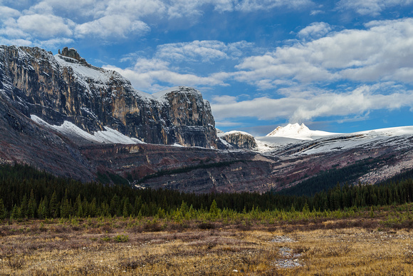 The impressive east wall of Pipestone / Cyclone peaks with the Drummond Icefield in the distance.