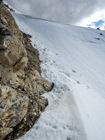 Looking up the shallow couloir to its exit above.