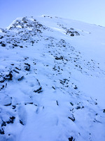 Scree covered snow made for slick conditions with the 'shoes on.