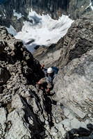 Eric negotiates a steep chimney just before the summit block.