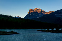 Fortress Mountain glows in morning lighting from near the Athabasca River crossing.