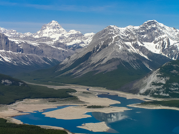 Incredible views over a very low Spray Lakes reservoir at the mighty Mount Assiniboine and Cone Mountain on the right.