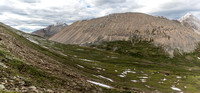 Views back to Divide Pass (L) from the east ascent slopes of Chirp Peak.