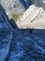 Dave follows up the slabby access gully that must be followed a good way up beside the ridge before crossing over onto the ridge proper and ascending it directly.