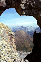 Pocaterra Ridge is perfectly framed through the infamous 'window' in the ridge to the summit of Tyrwhitt.