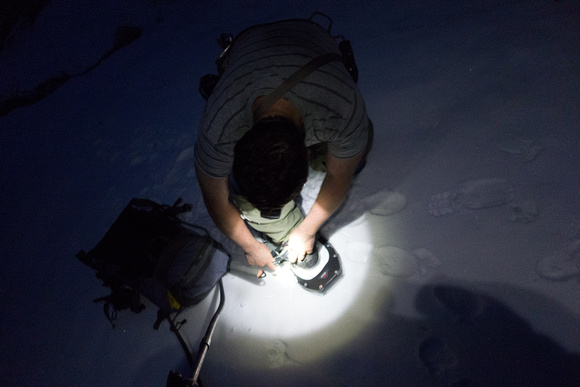 Putting on the snowshoes in the dark.