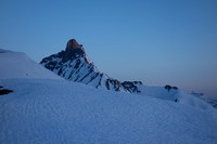 Hiking up the ridge in pre-dawn light on a firm snow crust. Hilda Peak visible here.