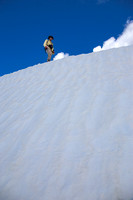 Ascending the summit snow banks.