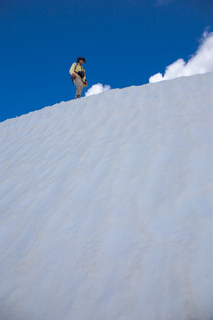Ascending the summit snow banks.