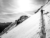 Bill on steep snow slopes under the summit ridge.