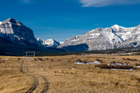 Warden Rock and Wapiti with horses in the foreground.