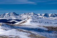 Views back over the false summit to Well Site Mountain with Wapiti at left.
