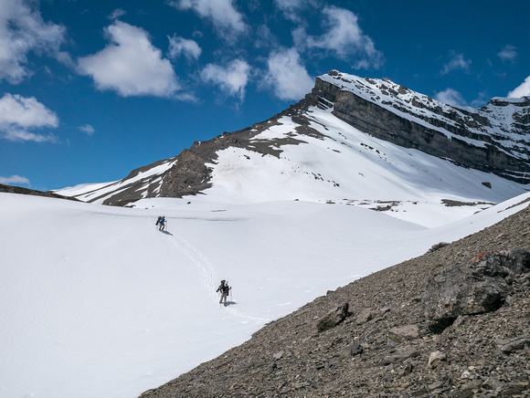Heading up a snow gully to the pass.