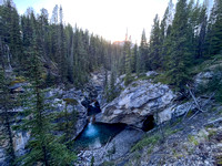 A scenic waterfall near the Flints Park campground with the North Cascade River flowing towards the Cascade River.