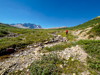 Hiking the Afternoon meadows between Afternoon and Frances Peak (L) and Mount McDonald (R).