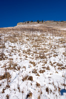 The grassy slope to the ridge. You can head straight up or go to climber's right and then back left on gentler slopes.