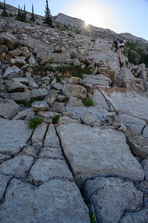 Scrambling up scree and slab to the west outlier.