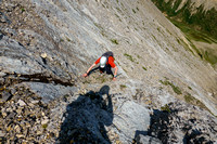 Scrambling up slabs and scree on the east face of Tyrrell.