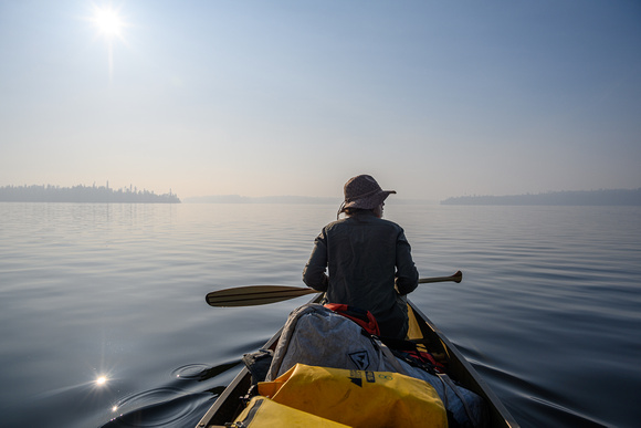Paddling a calm Otter Lake along the Churchill River.
