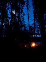 The moon rises over my fire on Sunday night on Onnie Lake.