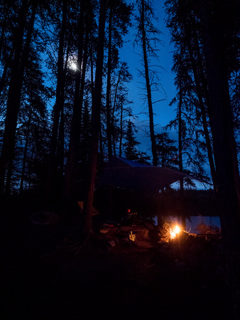 The moon rises over my fire on Sunday night on Onnie Lake.