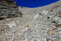 Scree in the SW bowl beneath the summit of Otuskwan Peak.