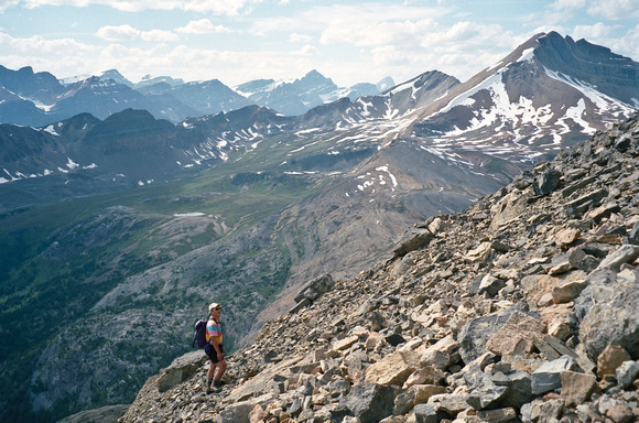 Sonny labors up the loose slopes of Dolomite with a view of Cirque Peak opening up in the background.