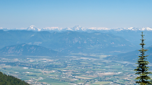 Zooming in on the mountain ranges to the north, across the Fraser Valley.