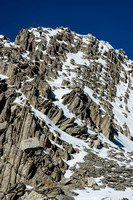 Two people coming down from the false summit.