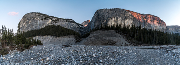 Sunrise on Devil's Head and cliffs along the Ghost River Trail.