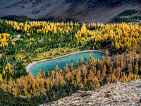 The ethereal beauty of the smaller, south Rainy Lake is enhanced by the larches surrounding it.