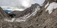 An extremely foreshortened and deceptively easy-looking view along the scree / snow ramp to the summit of Elliott Peak.