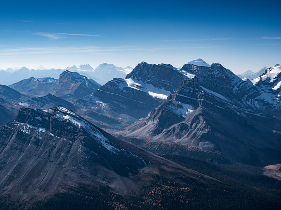 Looking over the Skoki Lakes towards familiar Lake Louise peaks such as Bident and Quadra at left and Temple