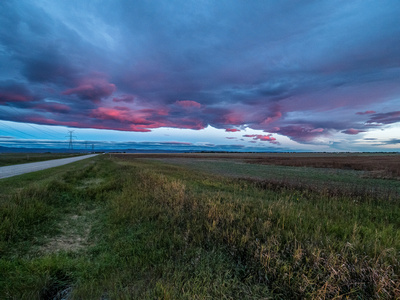 I waited too long to stop for this morning sunrise shot but got the tail end of it just past Nanton.