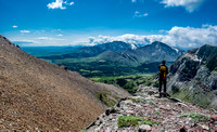 Kaycie enjoys the views towards Pincher Ridge (c) with Drywood Mountain at left. Chief Mountain in Montana is barely visible in the far distance at left.