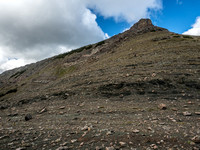 Looking up at several hundred meters to the summit of Ma Butte from the col.