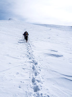 Following the previous group's tracks to the false summit from the top of the south ridge.