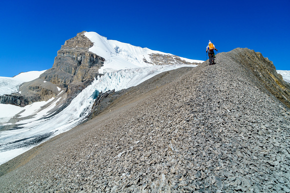 Ben makes his way up scree towards the glacial bench on Warren.