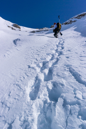 Ferenc continues to break trail for a while as we get higher up the west face beneath the AA col.