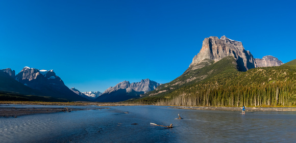 Liam crosses the Chaba with Quincy on the left and Fortress Mountain towering above.