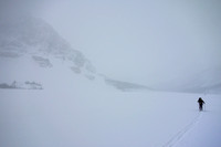 Skiing across Bow Lake in a white-out