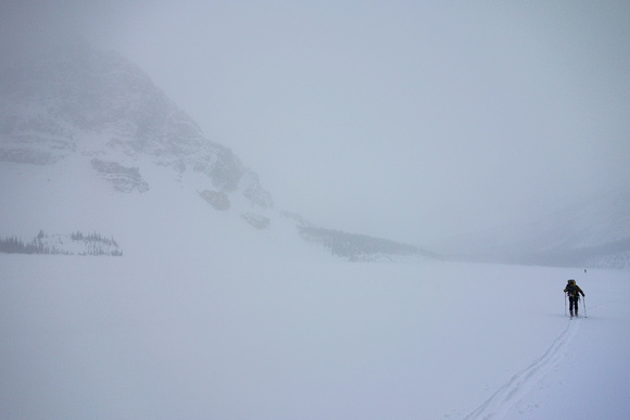 Skiing across Bow Lake in a white-out