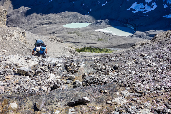 The two glacial lakes are now in full sun as we struggle our way up the amphitheater on loose rocky ledges and small cliff bands.