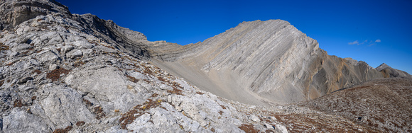View of Highwood Peak from the low shoulder. The route up a scree ramp from mid photo to upper right