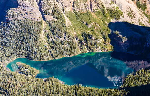 A long way down to the sublime Lake O'Hara and it's lodge. A lone kayaker barely visible on the calm lake