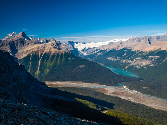 Looking across the Howse River to Glacier Lake. Mounts Outram and Forbes rising on the left.