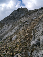 Steep and loose terrain above the col.