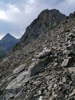 Steep and loose terrain above the col.