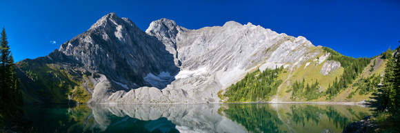 Mount Fox looms over Frozen Lake. The ascent ridge runs from the right side up to the left.